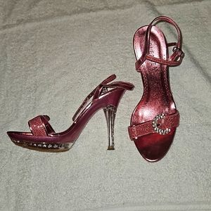 Shocking pink Pleaser strap heels with plenty of bling